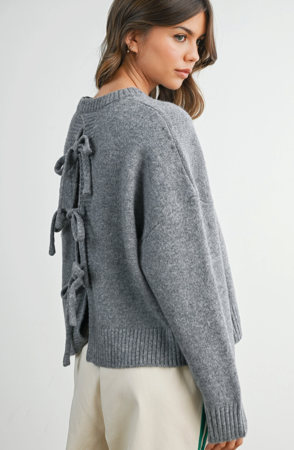charcoal grey sweater with bow detail